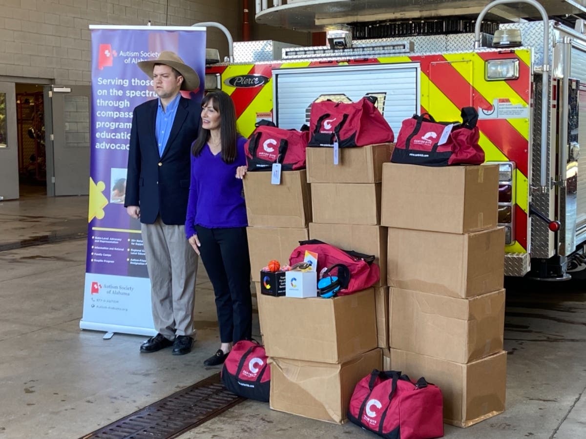 Sam Dowling, left, donated 35 Carter Kits to area agencies on Monday. 