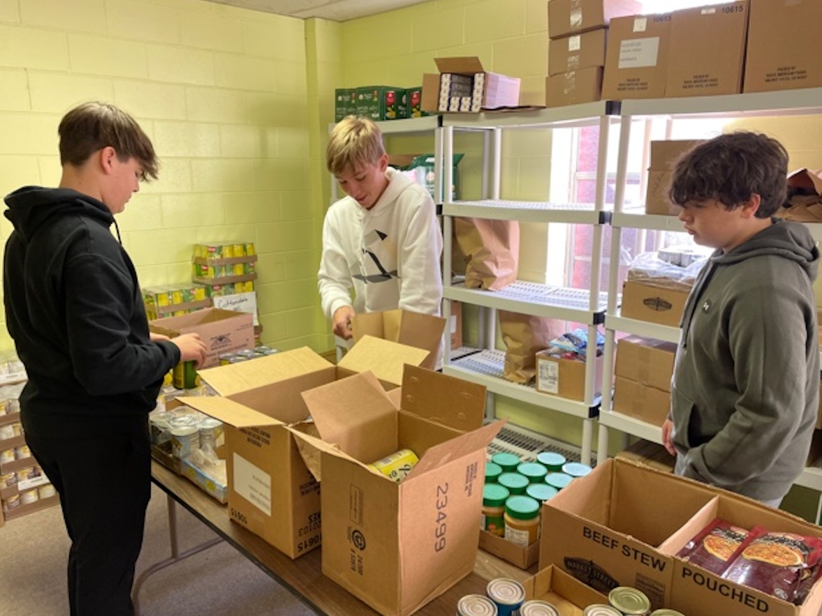 TA students donated their time to pack boxes for the West Alabama Food Bank 