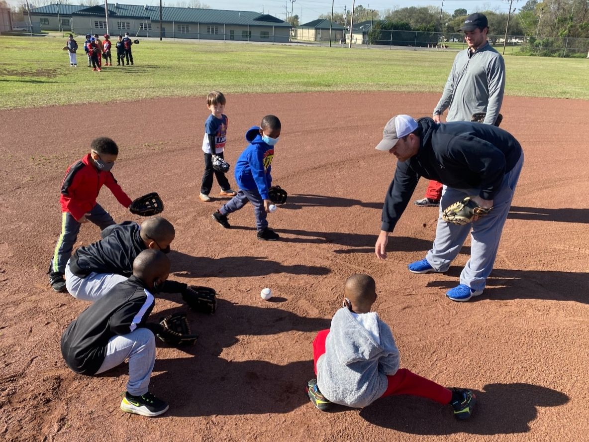 Coaches worked with children during last year's clinic to kick off the beginning of the Druid City Baseball League. 