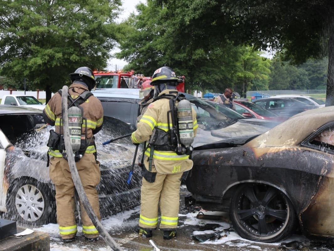 Firefighters on the scene of the vehicle fires at Hillcrest High School