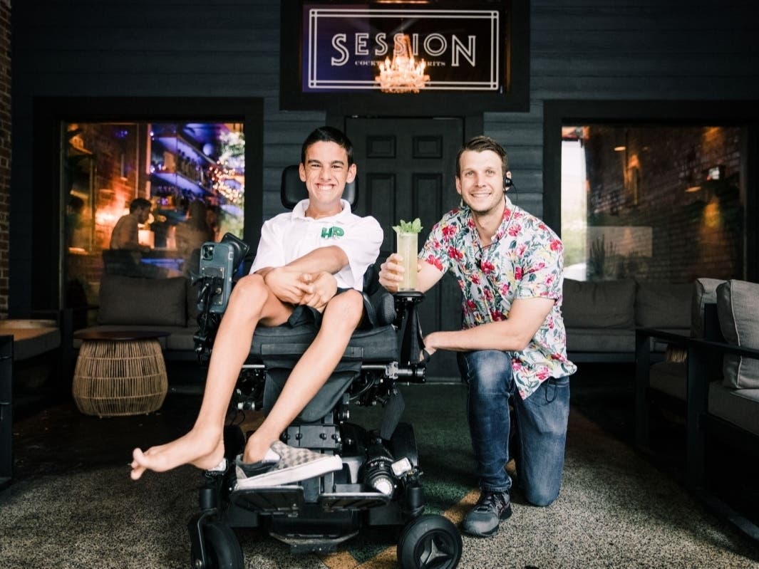 Hank Poore, left, and Session Cocktails owner Hunter Wiggins pose with October's Cocktail for a Cause: "The Hank"