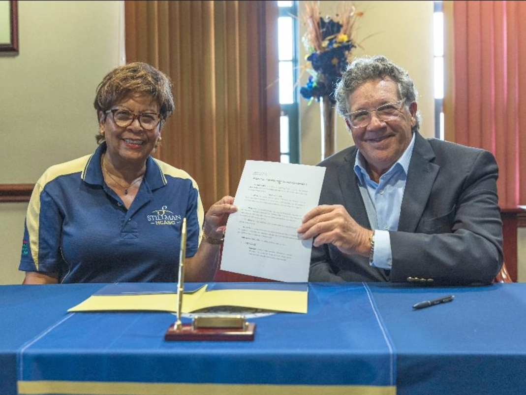 Stillman College President Cynthia Warrick (left) and Rick Lee, board president for Arts 'n Autism, signed a memorandum of understanding to allow Arts 'n Autism students in their LIFEE program to take courses for degree credit at Stillman.