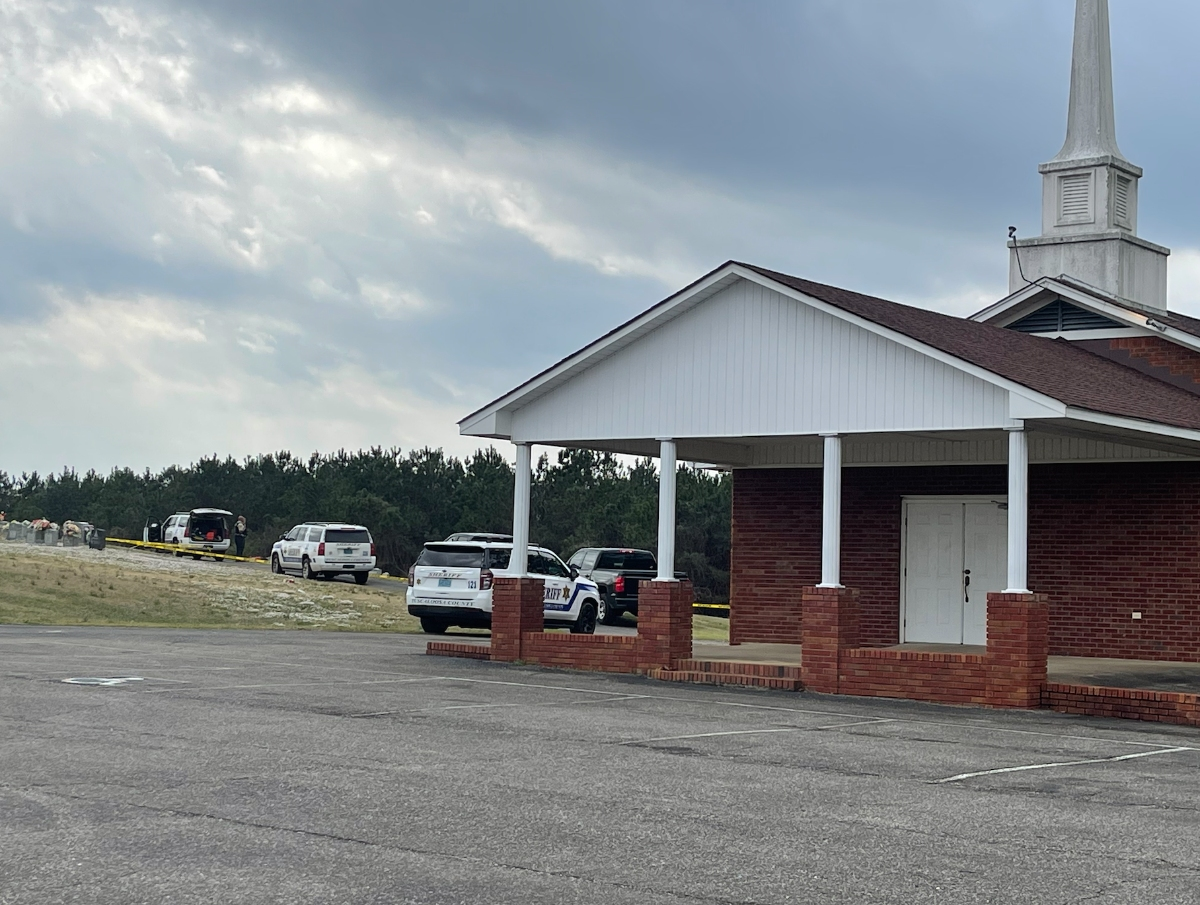 Investigators cordoned off a section of cemetery at Phillips Chapel Freewill Baptist Church on Monday. 
