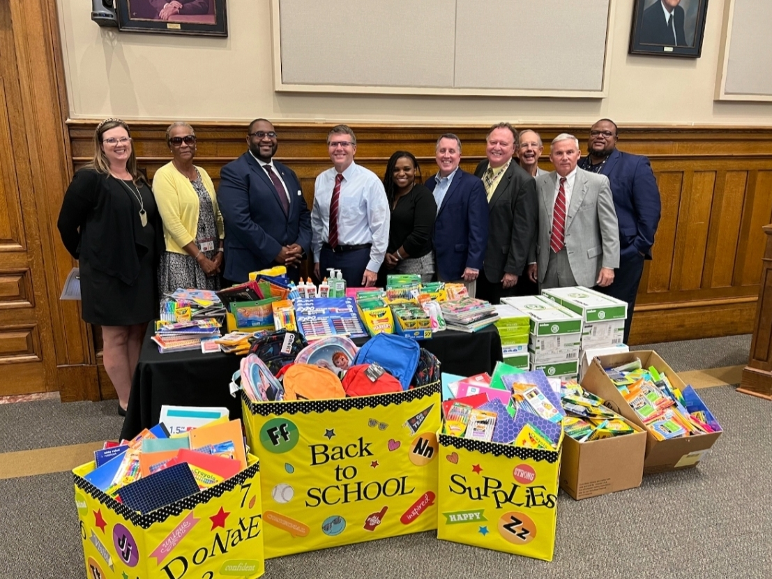 City officials pose with donations collected last year