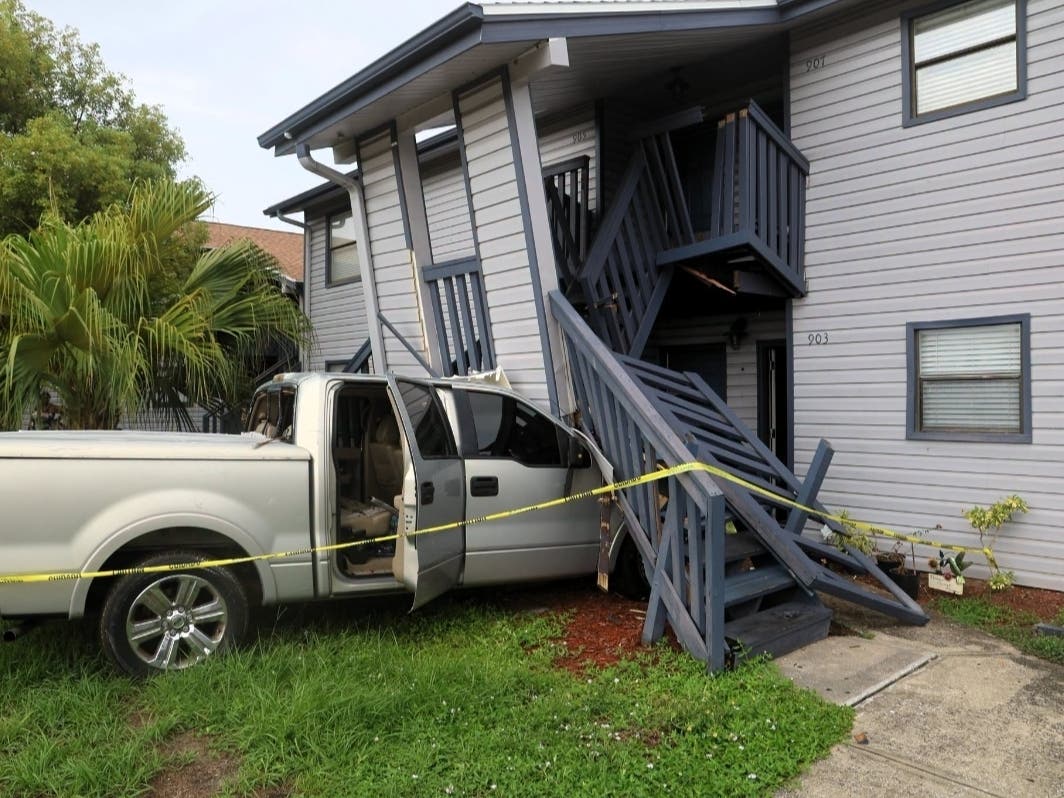 Officials said the crash caused significant structural damage and forced the evacuation of both buildings.