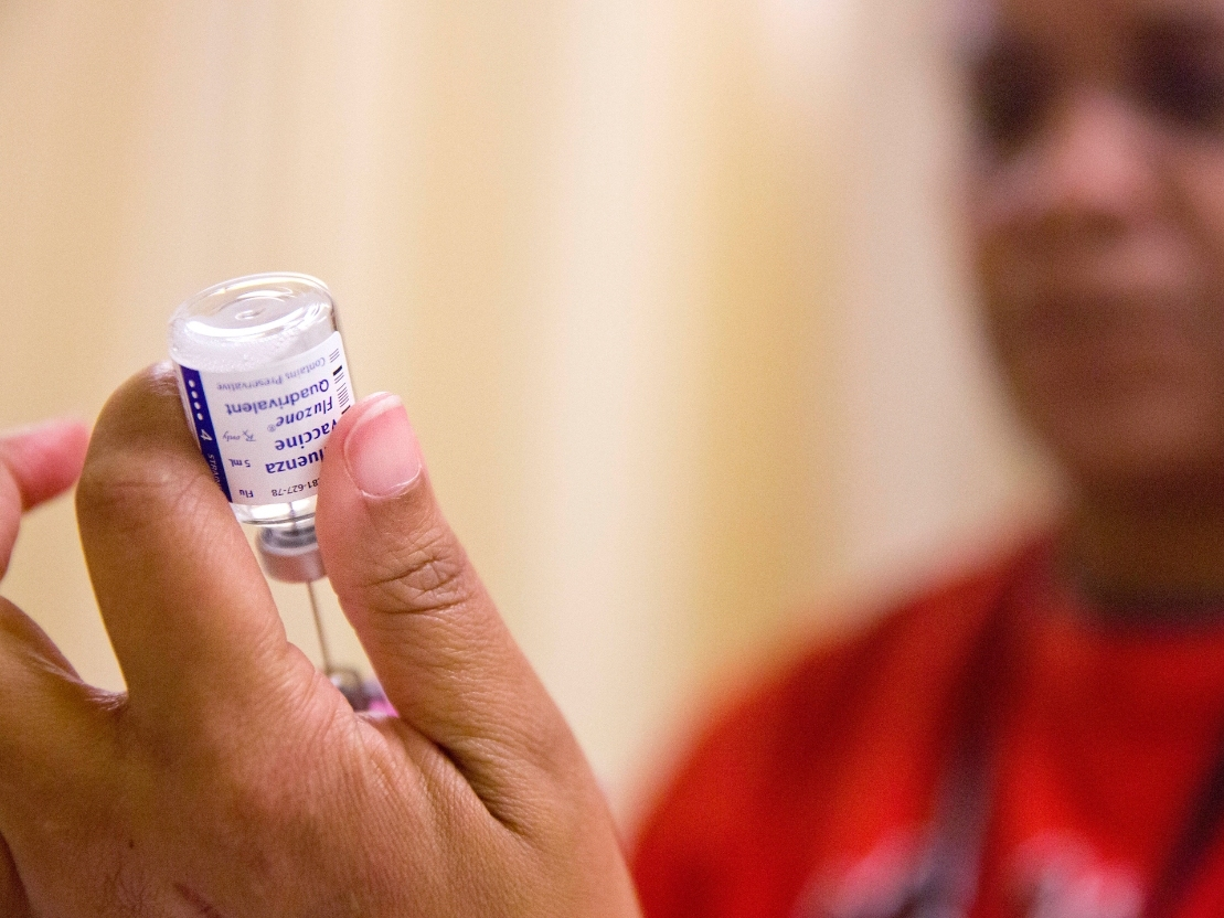 A nurse prepares a flu shot from a vaccine vial at the Salvation Army in Atlanta, Feb. 7, 2018.