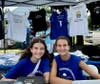 “Get Your Greek On” … Volunteers sell t-shirts at Greek Fest 2025.