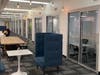 Open-concept desks are now closed off to create designated private offices with sliding doors, small tables and chairs. Each lockable 8x9 or 8x10 office was renovated to include new HVAC, lighting, electric, carpet, drywall, and insulation.