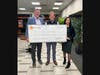 Joseph Flanagan (from left), Cook County Health Foundation board chairman, receives a Giving Tuesday donation from Tracy McGuire, Byline Bank’s Evanston market president, and Ivette Ramirez, senior branch manager at Byline Bank.