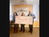Dulce Vargas (center), Kendall County Community Food Pantry assistant director, receives a Giving Tuesday donation from Soledad Gaytan (left), manager of the Byline Bank Oswego branch, and Ken Holmstrom, Byline Bank Oswego market president. 