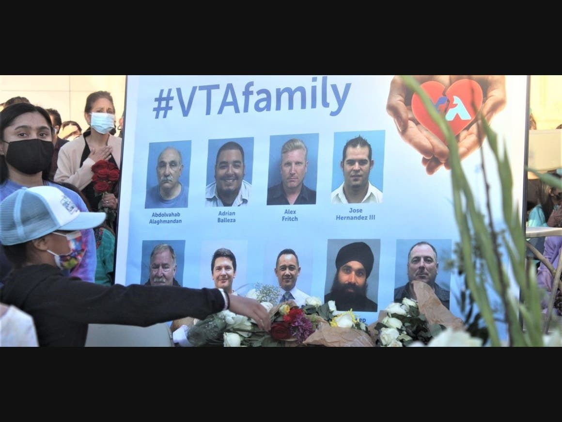 A poster displaying the nine VTA workers killed in Wednesday's mass shooting at a light rail yard in downtown San Jose.