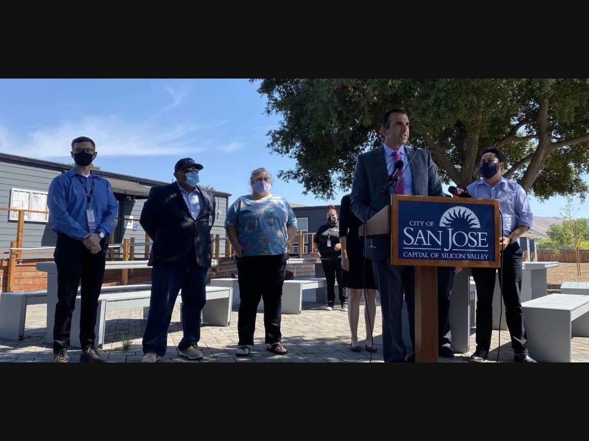 Mayor Sam Liccardo unveils the "Compassionate and Clean San Jose" plan at the city's interim housing site on Rue Ferrari. 