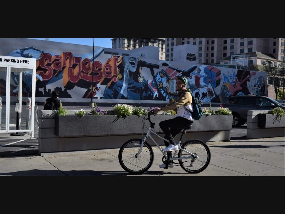A man rides his bicycle in a leisurely manner in downtown San Jose on April 13, 2023. VTA could approve construction of the Central Bikeway—a 10-mile stretch of protected bike lanes between San Jose and Santa Clara—as soon as next month.