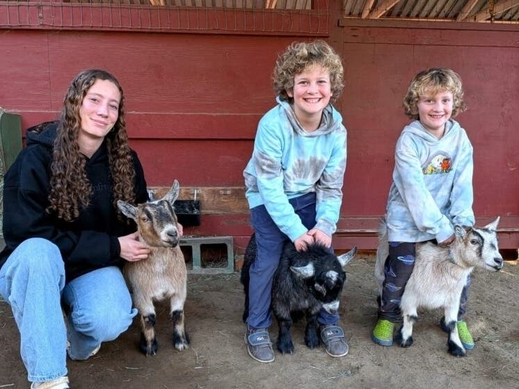 Aaliya, Fritz and Richard Vogel raise goats at the Rolling Hills 4H Club at McClellan Ranch in Cupertino. 