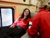 Delaware State Representative Sophie Phillips donates blood with Blood Bank of Delmarva phlebotomist Liv Starling at Legislative Hall.