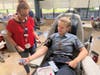 Blood Bank of Delmarva Manager Lynda Letts examines the veins of whole blood donor Katia Shchepetova, a paramedic with Narberth (Pa.) Ambulance.