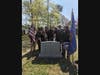 Members of various local social, fraternal and service organizations stand behind the Saint James A.M.E. Zion Church Cemetery marker, installed in 2007. 