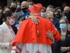 Cardinal Dolan of New York hugs Mark Anderl
