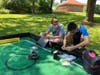 Niklas Austermann and Mark Ogata working on their robot at Grovers Park a few months ago.  