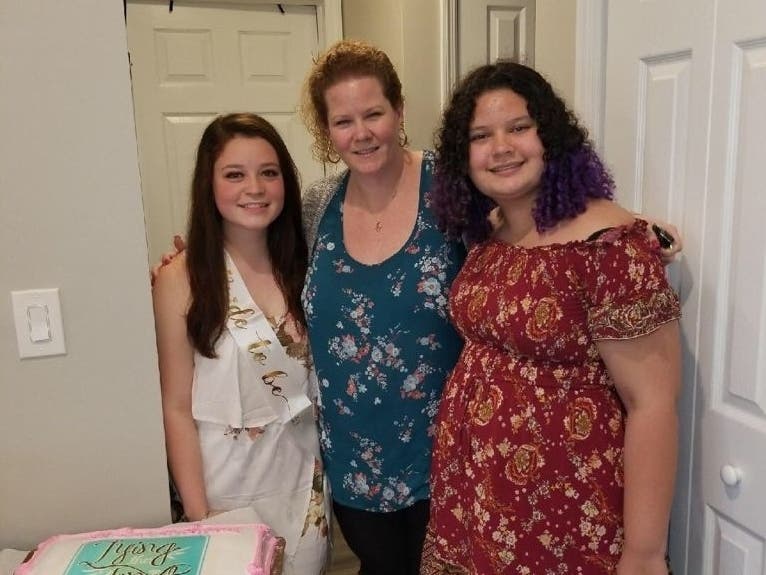 Erin Popolo (center) with her daughters Emily (right) and Kaylee (left)  