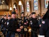 Bagpipers from Middlesex County Police and Fire Pipes and Drums play “Amazing Grace,” as part of the tribute to fallen officers at the Diocese of Metuchen’s 19th Annual Blue Mass. 