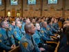 Law enforcement personnel listen to the homily delivered by Fr. Charles T. O’Connor, pastor of St. Cecilia Parish, Monmouth Junction, at the 19th Annual Blue Mass.
