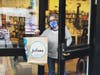 Co-owner Joanne Farrugia in the doorway, doing curbside pick-up,