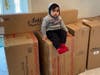 Ayaansh poses with the items he accidentally ordered from Walmart. 