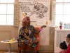 Harmonica Sunbeam reading to families.