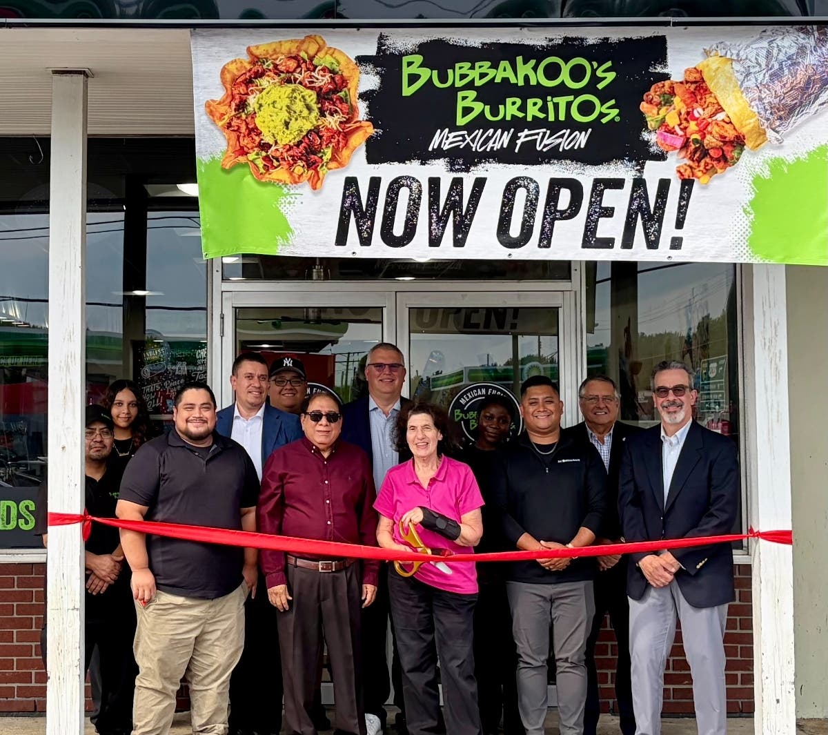 Mayor Janice S. Mironov and Council Members join Bubbakoo's Burritos owner, management and staff to cut the ribbon celebrating their grand opening