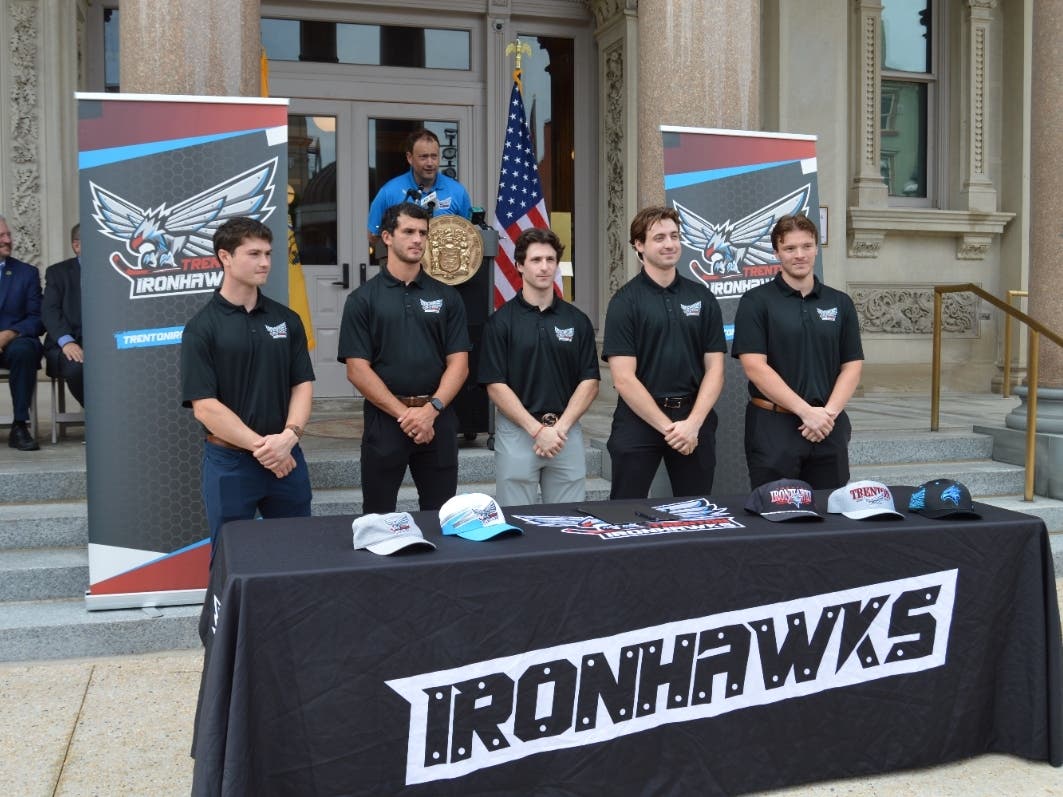 The plays pose on the steps of the State House during the announcement