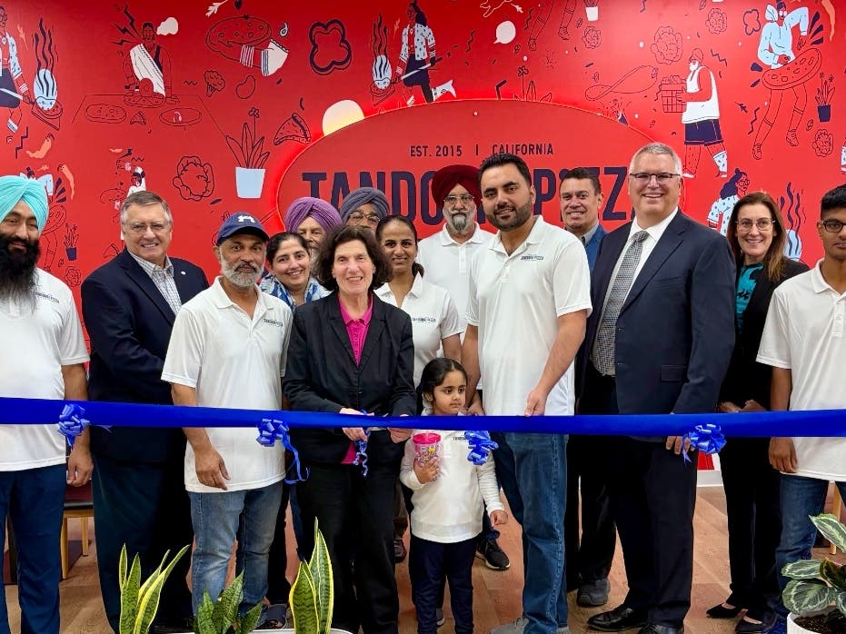 The Mayor and councilmembers with the owners at the ribbon-cutting ceremony