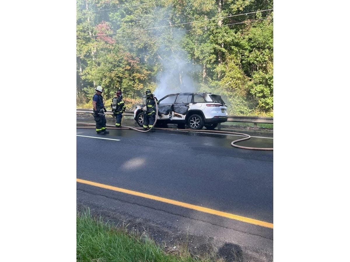 Police closed the highway for about 20 minutes while firefighters worked to extinguish the flames
