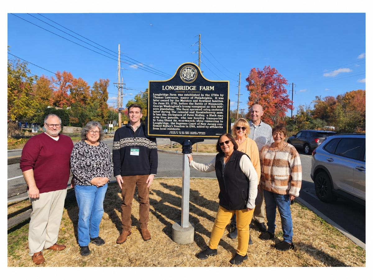 Township officials attend the unveiling of the marker