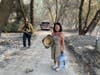 Thao Le (right) works to evacuate all 105 animals from her sanctuary, Lucky Ones Ranch, which burned down Aug. 19.