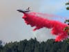 A wide-body airliner makes a drop on a ridge near the resort town of Guerneville, Calif., in Sonoma County. 