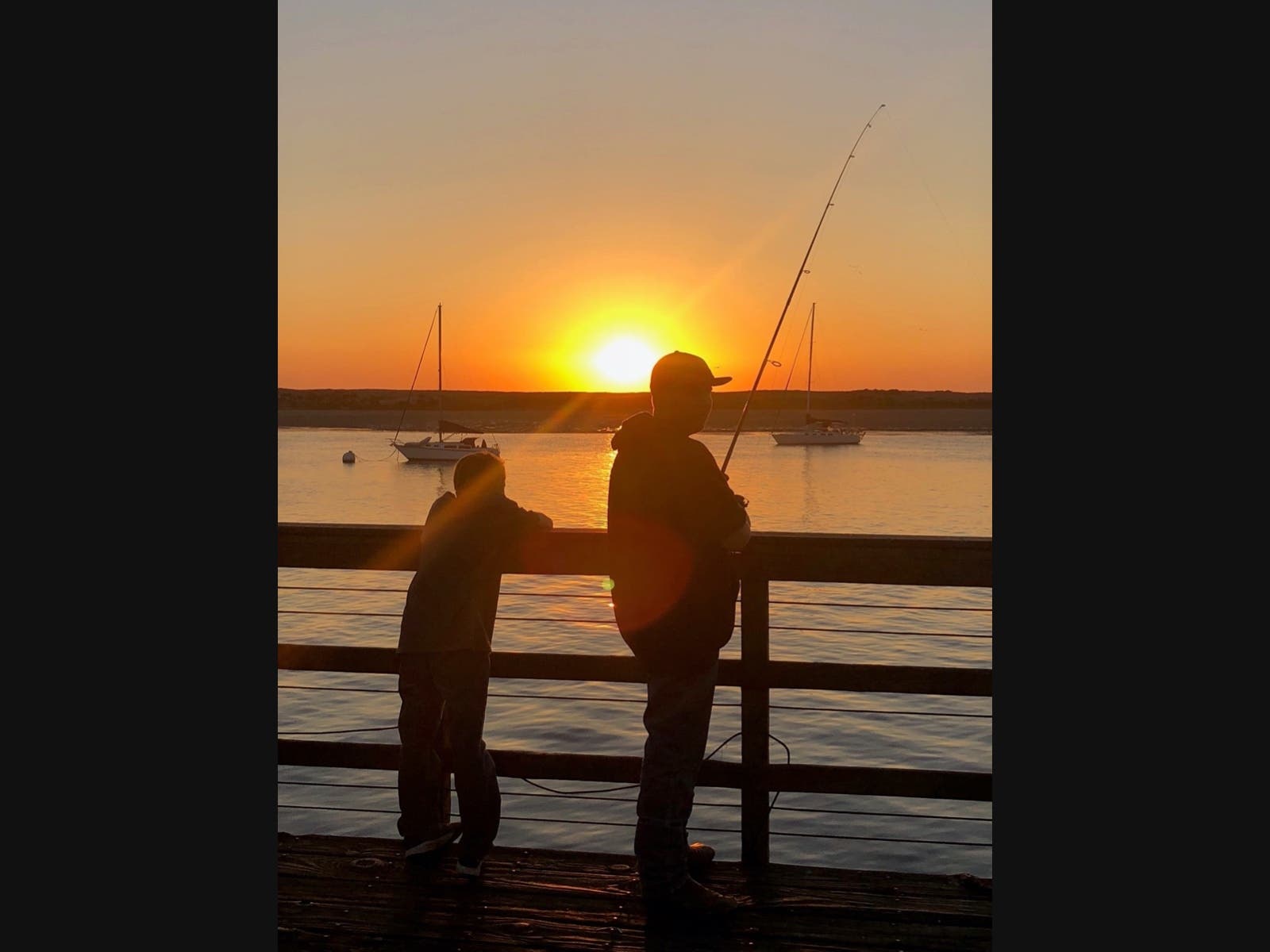 Kari Thomas shares an image of her two sons fishing during golden hour in Morro Bay. 