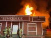 Flames charred an abandoned "The Riverside" commercial building in Lake Elsinore early Saturday morning.