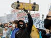 Some 500 people hit the streets of Huntington Beach as tensions rose over news of a planned White Lives Matter protest.  