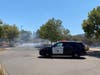 A blaze near a large Santee apartment complex shrouded the area and nearby vegetation in smoke.