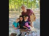 Tyler and Meredith Pointier and their daughters help decorate bags for the Brown Bag Buddies program. Children helping children to ensure others do not go without a healthy meal.