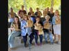 Morris Plains Democratic Committee members and volunteers show off just a few of the decorated brown lunch bags to be distributed to children in Morris County in need of a healthy lunch.