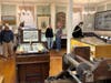 Visitors explore artifacts on the first floor of the Old Town Hall Museum.