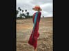 One of the "Silent People" wears a dress, scarf and hat