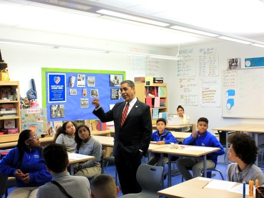 Rep. Adriano Espaillat visits students in East Harlem prior to the COVID-19 pandemic.
