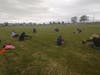 Athletes practice social distancing as they complete their cool-down stretching.