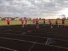 Mid-distance and distance runners practice social distancing.
