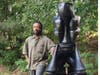 Willie Cole with his sculpture "The Sole Sitter"