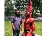 Willie Cole and his sculpture "Woman in Heels" on the Summit Village Green, 2021. 