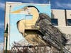 "The Watcher," a large-scale mural by Philadelphia-based artist Paul Santoleri, keeps watch over Lyric Pocket Park in downtown Summit. 